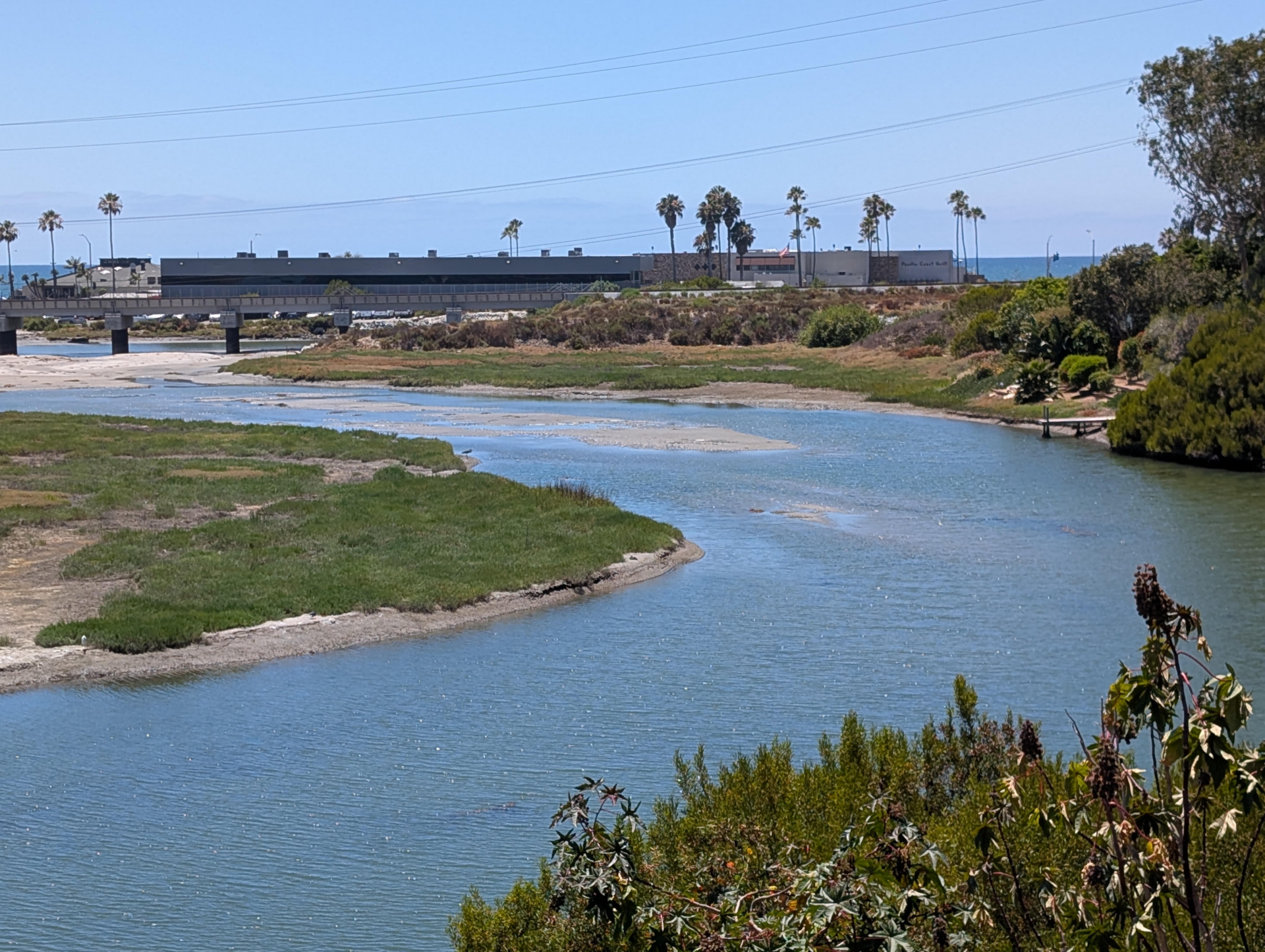San Elijo Lagoon channel with water and sand blockage